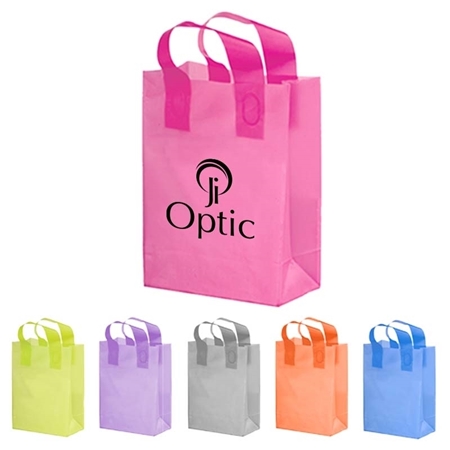 A set of colorful tote bags with a larger pink bag featuring the "Optic" logo in black. Smaller bags in yellow, purple, gray, orange, and blue are lined up below.