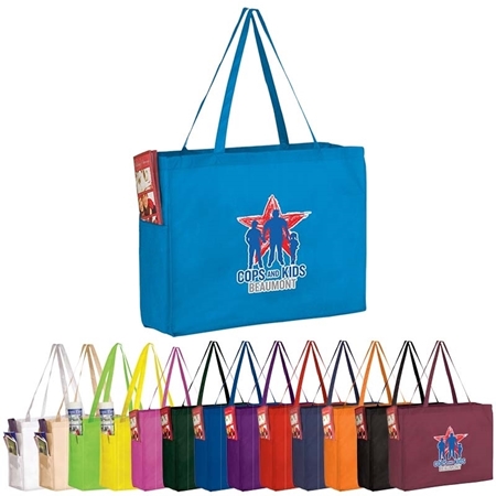 A collection of colorful tote bags with long handles displayed in various colors. The prominent blue bag has a logo with "Cops and Kids Beaumont".