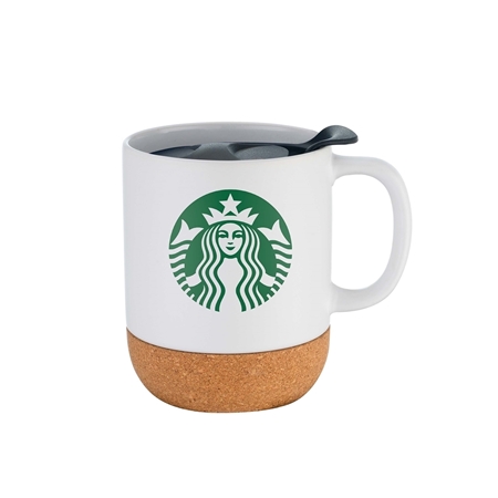 White coffee mug with a cork bottom and green Starbucks logo. A black lid rests on top. The sleek design conveys a modern and eco-friendly vibe.